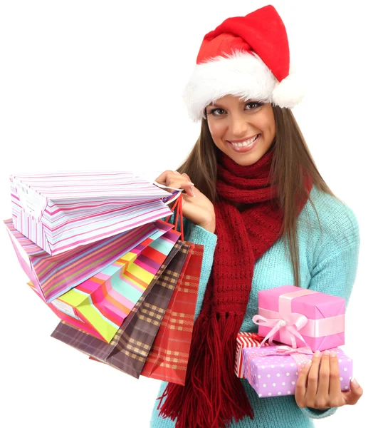 Beautiful young woman with shopping bags and gifts, isolated on white — Stock Photo, Image