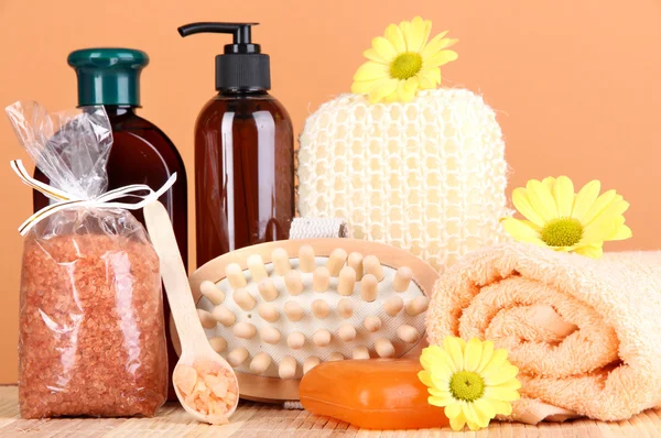 Set for care of a body on peach background — Stock Photo, Image