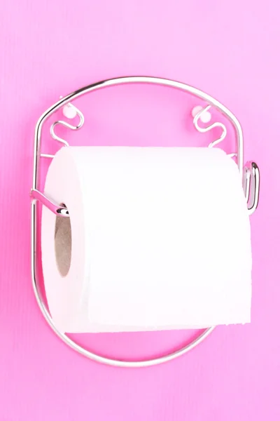 Roll of toilet paper on holder fixed to wall — Stock Photo, Image