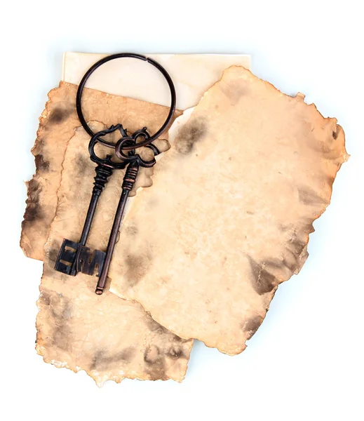 Old paper with key isolated on white — Stock Photo, Image