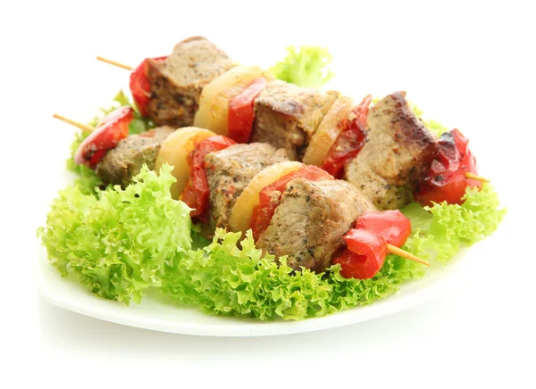 Tasty grilled meat and vegetables on skewers on plate, isoalted on white — Stock Photo, Image