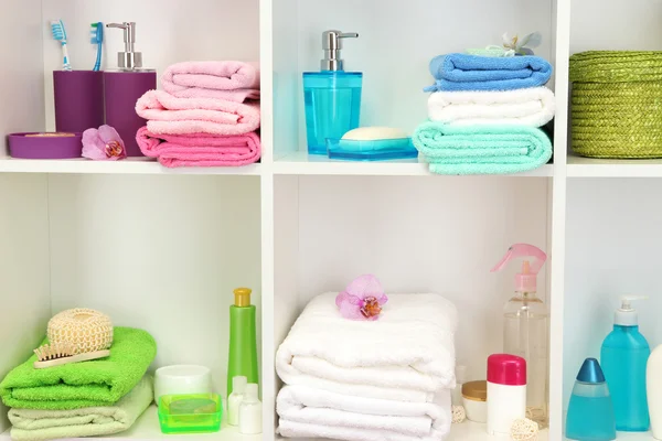 Bath accessories on shelfs in bathroom — Stock Photo, Image