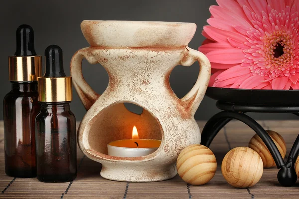 Aromatherapy lamp on grey background Stock Photo