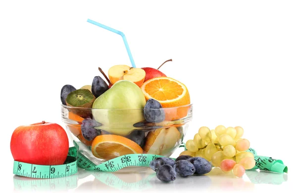 Glass bowl with fruit for diet and measuring tape isolated on white — Stock Photo, Image