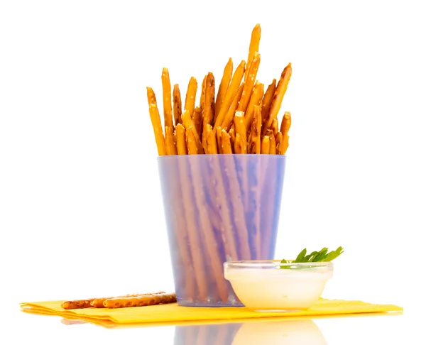 Tasty crispy sticks in purple plastic cup isolated on white — Stock Photo, Image