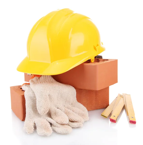 Helmet, roulette, bricks and gloves isolated on white — Stock Photo, Image