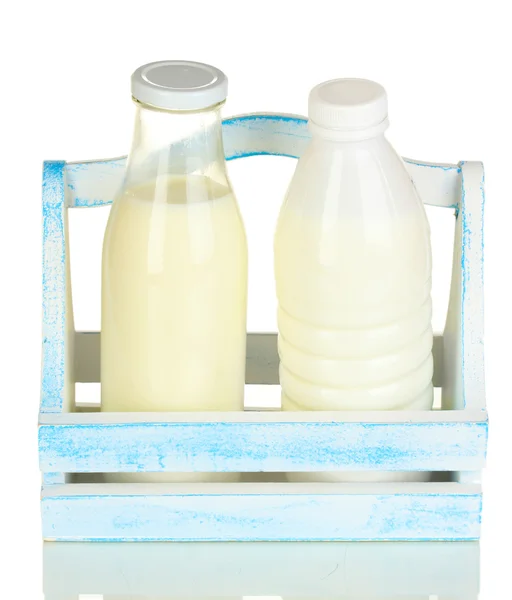 Milk in bottles in wooden box isolated on white — Stock Photo, Image