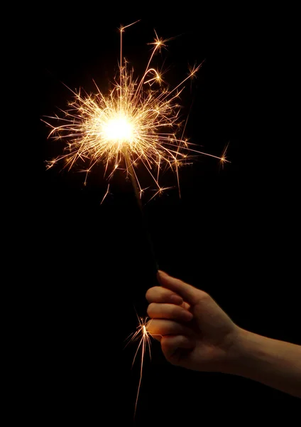Beautiful sparkler in woman hand on black background — Stock Photo, Image