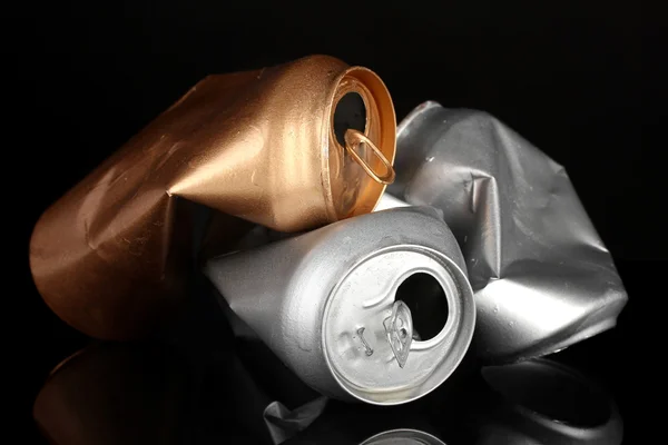 Crumpled empty can isolated on black — Stock Photo, Image