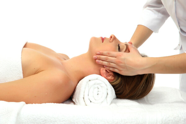 Portrait of beautiful woman taking head massage, isolated on white