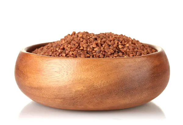 Raw buckwheat in wooden bowl isolated on white — Stock Photo, Image