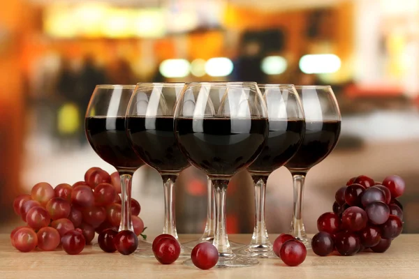 Red wine in glass on room background — Stock Photo, Image