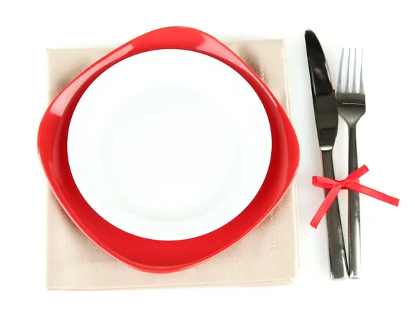 Empty red and white plates with fork and knife isolated on white — Stock Photo, Image
