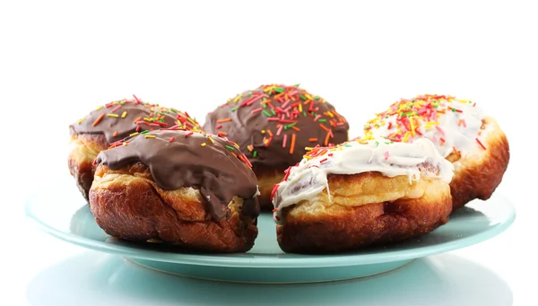 Velsmagende donuts på farveplade isoleret på hvid - Stock-foto