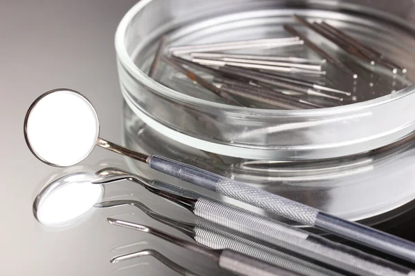 Set of dental tools for teeth care isolated on grey background — Stock Photo, Image