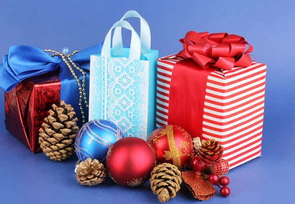 New Year composition of New Year's decor and gifts on blue background — Stock Photo, Image