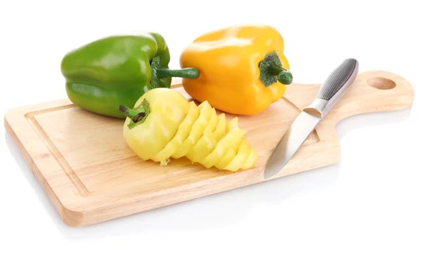 Paprika and knife on wooden cutting board isolated on white — Stock Photo, Image