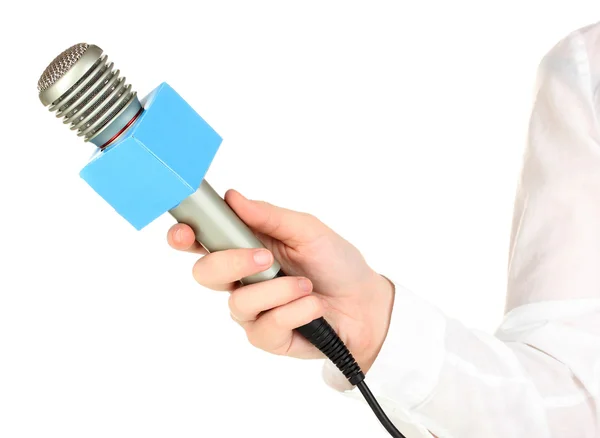 Mão feminina com microfone isolado em branco — Fotografia de Stock