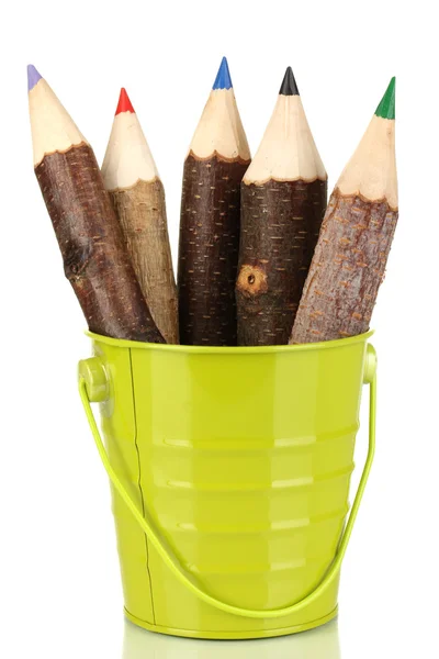 Colorful wooden pencils in green pail isolated on white — Stock Photo, Image