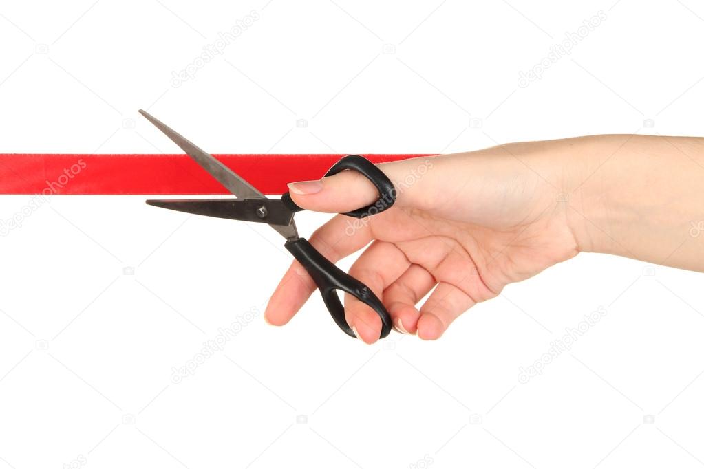 Cutting red ribbon isolated on white