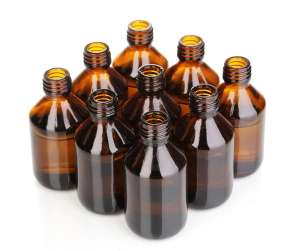 Medische flessen in de rij geïsoleerd op wit — Stockfoto