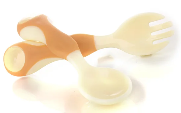 Cuchara beige pequeña y tenedor para bebés aislados en blanco —  Fotos de Stock