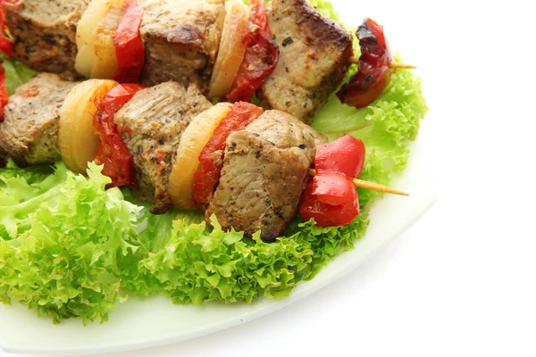 Tasty grilled meat and vegetables on skewers on plate, isoalted on white — Stock Photo, Image