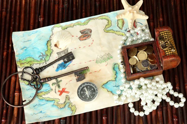 Map of treasures on dark wooden background — Stock Photo, Image