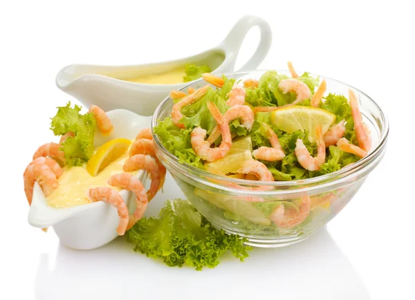 Salad with shrimps, lemon and lettuce leaves in bowl and sauce, isolated on white — Stock Photo, Image