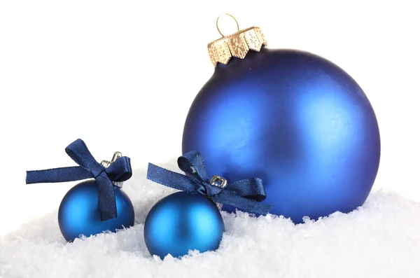 Beautiful blue Christmas balls on snow, isolated on white — Stock Photo, Image