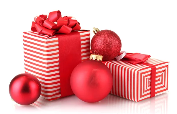 Colorful red gifts with Christmas balls isolated on white