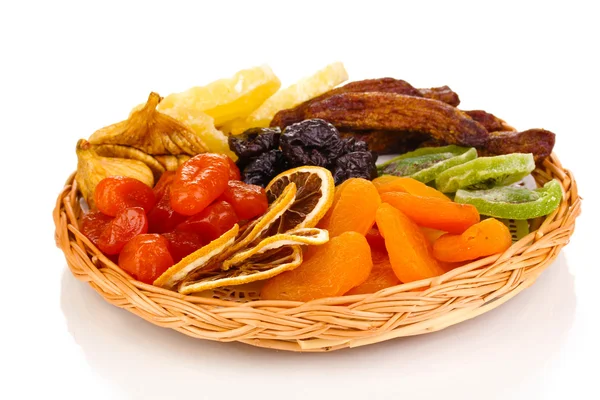 Dried fruits on wicker plate isolated on white — Stock Photo, Image