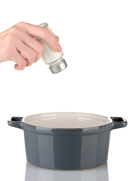 Hand lägga salt salt skakapparat isolerad på vit — Stockfoto
