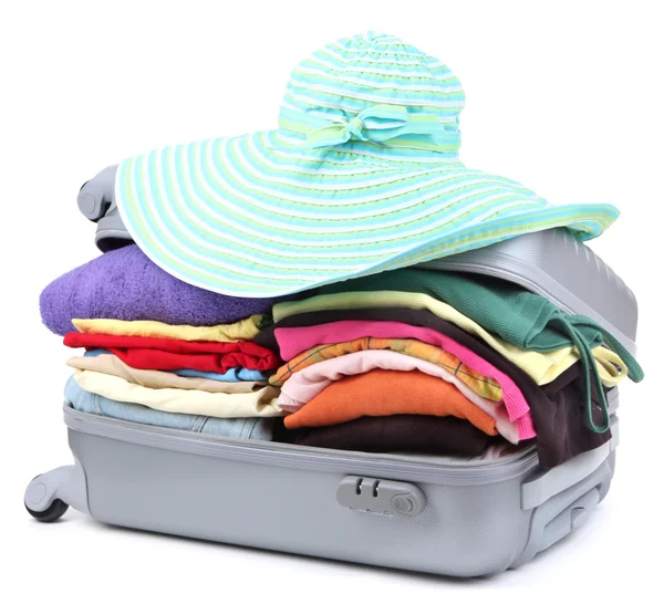 Geschlossener silberner Koffer mit isolierter Kleidung auf weißem Grund — Stockfoto