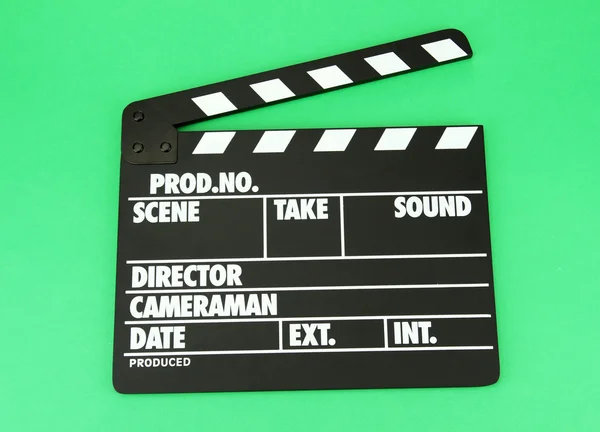 Movie production clapper board on color background — Stock Photo, Image