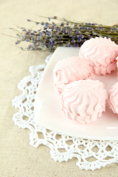 Marshmallows on plate on light background — Stock Photo, Image