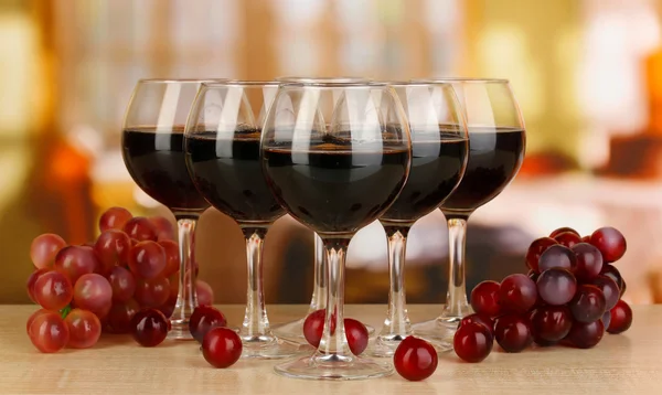 Red wine in glass on room background — Stock Photo, Image