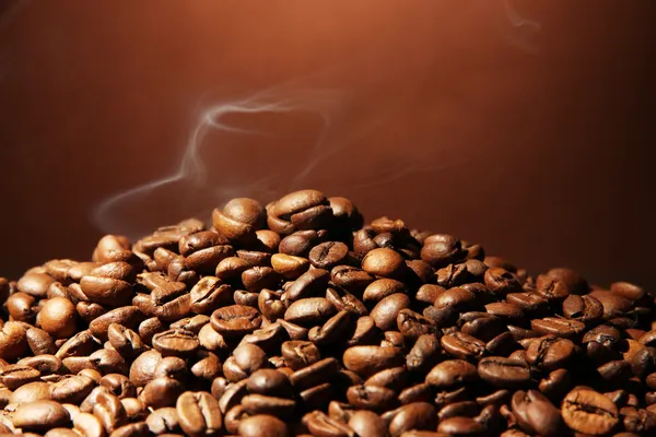 Coffee beans on brown background — Stock Photo, Image