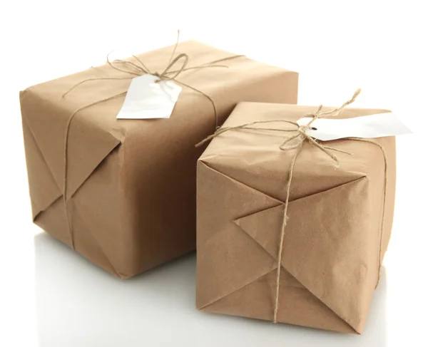 Parcels boxes with kraft paper, isolated on white — Stock Photo, Image