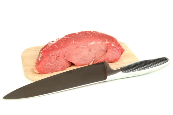 Raw beef meat with knife isolated on white — Stock Photo, Image