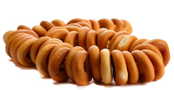 Tasty bagels on rope, isolated on white — Stock Photo, Image