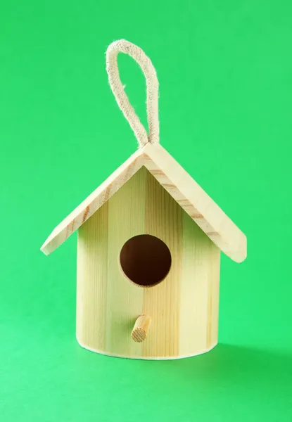 Nesting box on color background — Zdjęcie stockowe
