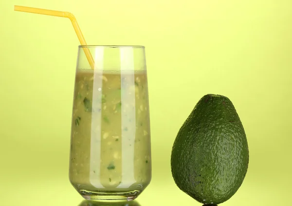 Useful fresh avocado on green background — Stock Photo, Image