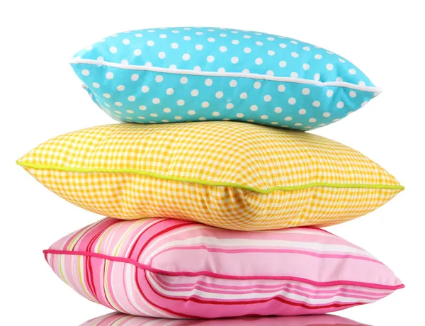 Travesseiros azuis, rosa e amarelos brilhantes isolados em branco — Fotografia de Stock