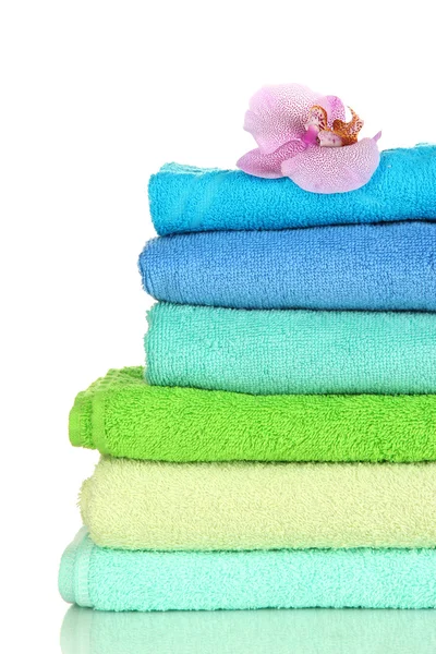 Stack of towels with fragrant flower isolated on white — Stock Photo, Image