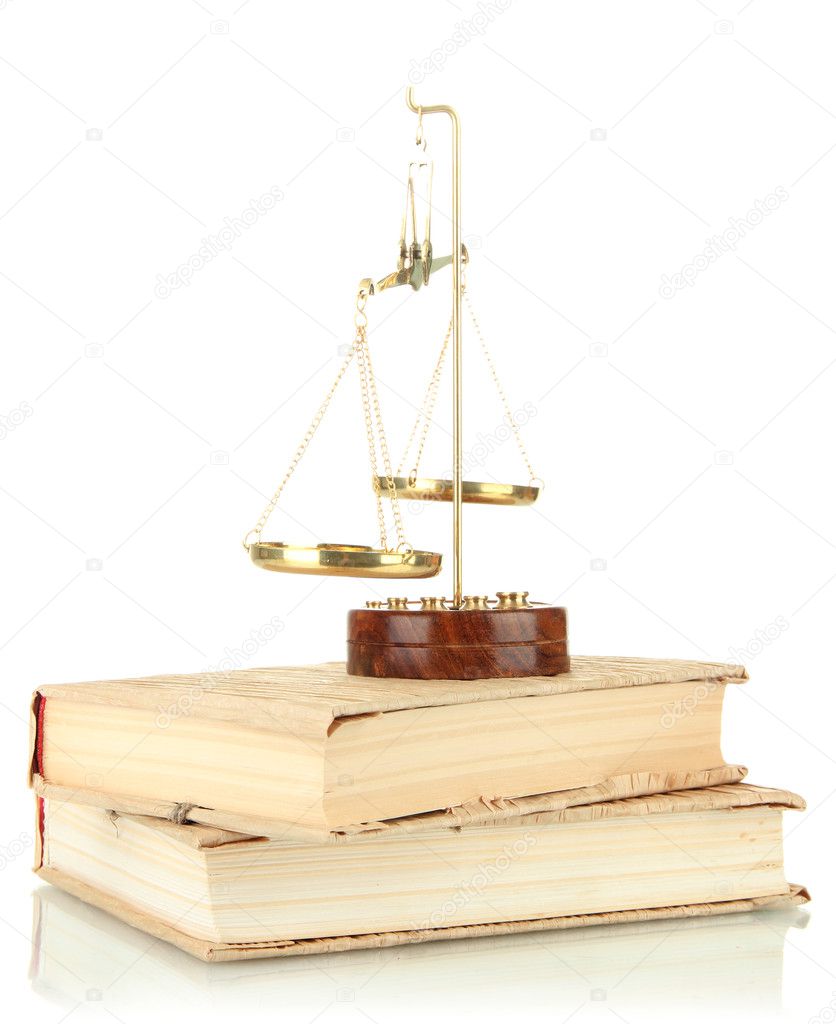 Gold scales of justice and books isolated on white