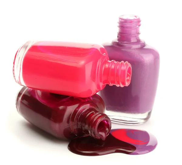 Open bottles with bright nail polish isolated on white — Stock Photo, Image