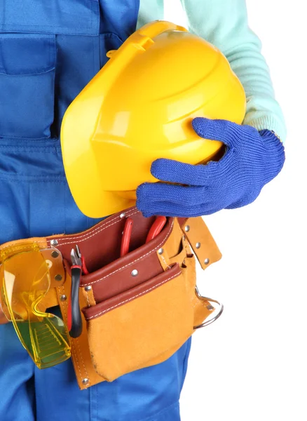 Construtor masculino em macacão azul com capacete amarelo isolado em branco — Fotografia de Stock