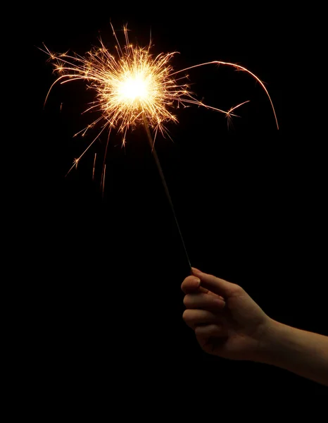 Beautiful sparkler in woman hand on black background — Stock Photo, Image