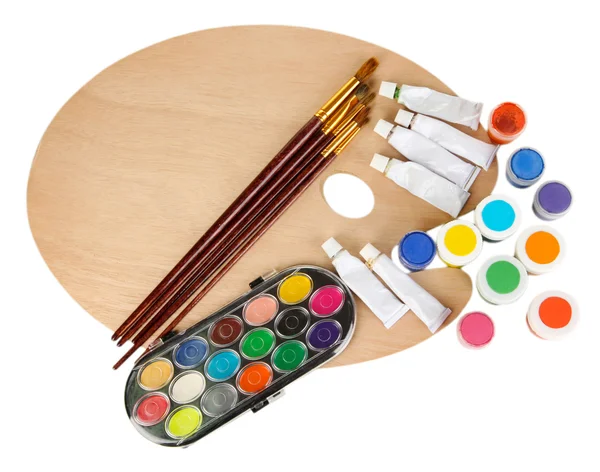 Wooden art palette with brushes for painting and paints isolated on white — Stock Photo, Image